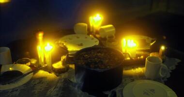CGI Candlelit dinner setting with food and drinks on a table at night video