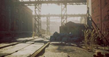 CGI Abandoned industrial area with overgrown tracks during golden hour light video