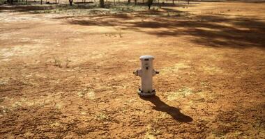 CGI Hydrant stands alone in barren landscape under the afternoon sun video