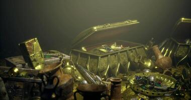CGI Treasure chests filled with ancient artifacts rest on ocean floor video