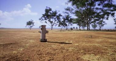 CGI Dry landscape with a fire hydrant under a clear sky video