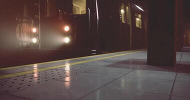 CGI Subway train arriving at platform during nighttime in urban setting video
