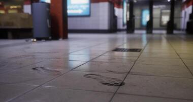 CGI Footprints on a subway station floor during early morning hours video