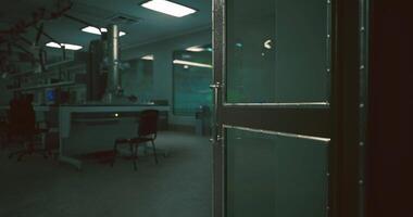 CGI Empty laboratory with open door at night revealing dim workspace and chairs video