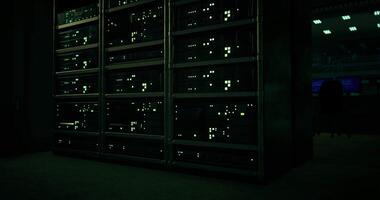 CGI Detailed view of illuminated server rack in dark tech environment video
