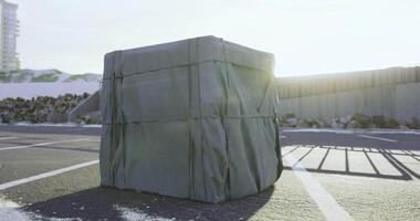 CGI Large wrapped object in a parking lot during bright daylight hours video