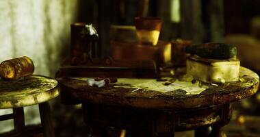 CGI Cluttered work table filled with tools and small objects in a dimly lit room video