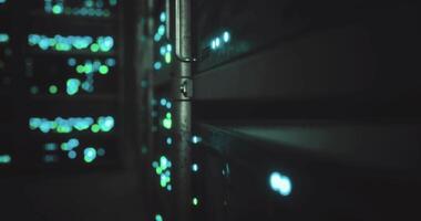 CGI Captivating view of illuminated server racks in a data center at night video