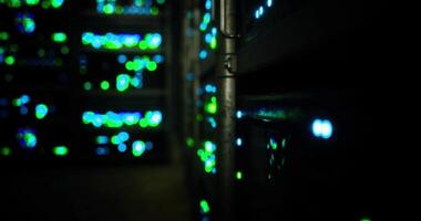 CGI Bright lights illuminate servers in a data center during nighttime operations video