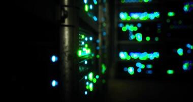 CGI Bright lights illuminate server racks in a data center during nighttime video
