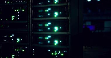 CGI Data center with illuminated server racks operating at night video