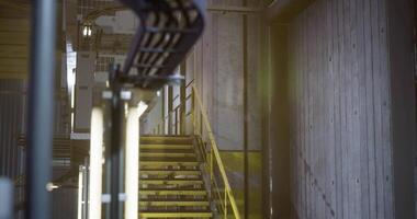 CGI Industrial staircase with yellow accents in modern building during daylight video