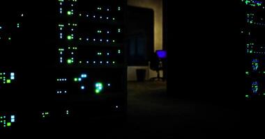 CGI Dimly lit data center showcasing glowing server lights and workstation video