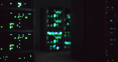 CGI Datacenter interior with illuminated servers in a dark environment video