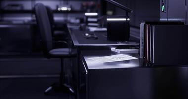 CGI Dimly lit office with empty desk and scattered documents at night video