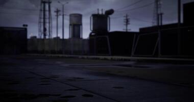 CGI Industrial site during twilight with shadowy structures and wet pavement video
