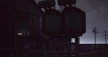 CGI Dark evening at an industrial site with electrical transformers and power lines video