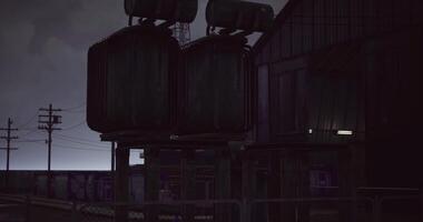 CGI Industrial structure illuminated at dusk with power lines nearby video