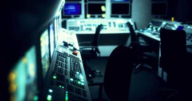 CGI Control room with illuminated panels and empty chairs in dim lighting video