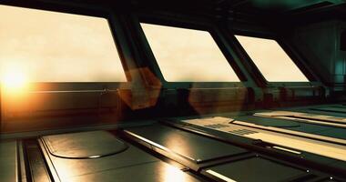CGI Inside a sleek, modern structure, large windows reveal a vibrant sunrise beyond video