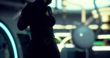 CGI Character silhouette stands in futuristic setting with vibrant lights video