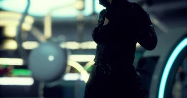 CGI Futuristic figure stands in silhouette within a glowing neon environment video