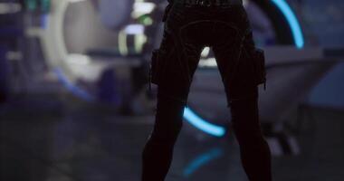 CGI Futuristic character in sleek outfit stands in high tech environment video
