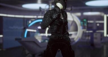 CGI Futuristic figure in sleek attire stands in advanced technological environment video