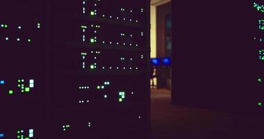 CGI Data servers illuminated in a dimly lit office environment at night video