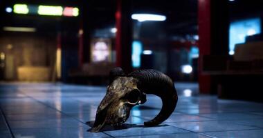 CGI Unusual ram skull resting on tiled flooring in a dimly lit underground space video