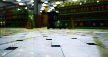 CGI Tiled floor in a vibrant grocery store with colorful shelves in view video