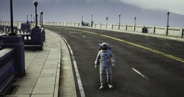 CGI Astronaut exploring empty urban street during daytime with cloudy sky video