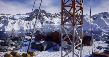 CGI Building a communication tower in a snowy remote mountain area video