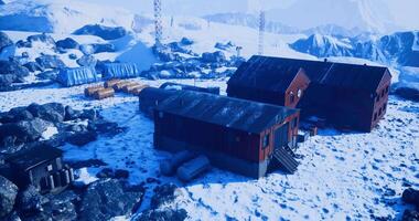 CGI A remote research station stands surrounded by snow covered mountains video