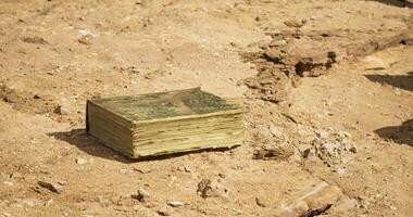 CGI Ancient book discovered in desert landscape revealing secrets of history video