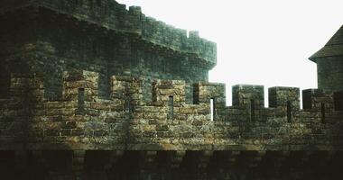 CGI Historic stone castle wall with tower under bright sky during the day video