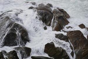 Ocean waves crashing on rocks seascape photography nature coast water power photo