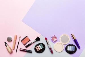 Professional makeup tools.Flat lay. Beauty, decorative cosmetics. Makeup brushes set and color eyeshadow palette on table background. Minimalistic style photo