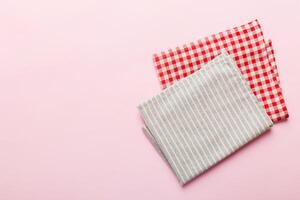 top view gray kitchen napkin isolated on table background. Folded cloth for mockup copy space photo