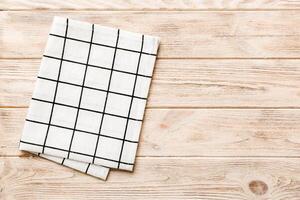 top view empty kitchen napkin isolated on table background. Folded cloth photo