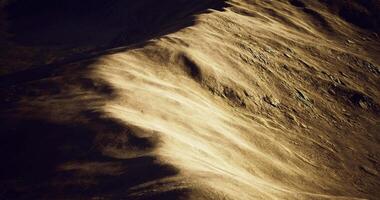 CGI Golden sand dunes span a vast desert, showcasing natural patterns video