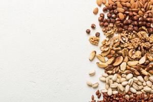 different nuts frame background. flat lay with vopy space. Walnut, almonds photo