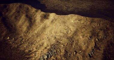 CGI Exploring rocky terrain under a dramatic sky at dusk in a remote landscape video