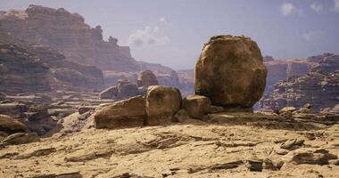CGI Large boulder formation in a rugged desert landscape under clear sky video