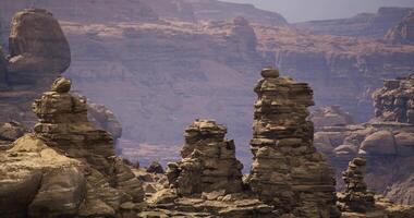 CGI Unique rock formations stand tall against a desert landscape backdrop video