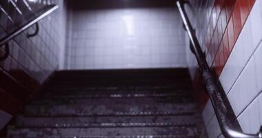 CGI Descent into dimly lit stairway with textured tiles and handrail video