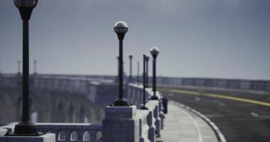 CGI View of street lamps along a winding bridge with an open road in the distance video