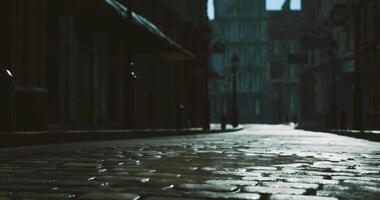 CGI Mysterious cobblestone street illuminated by soft morning light in an old town video