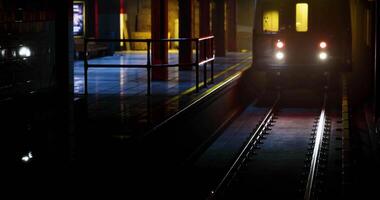 CGI Night train nears subway station, shimmering lights and reflections video