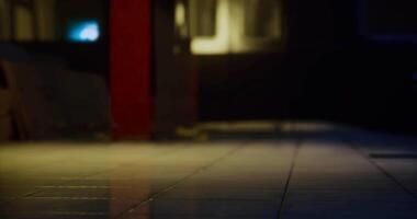 CGI Quiet urban alleyway at night with rays of light illuminating tiles video